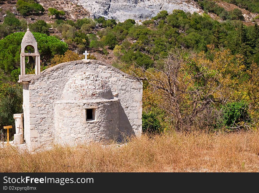 An old chapel in the woods in Greece. The island of Crete. An old chapel in the woods in Greece. The island of Crete.