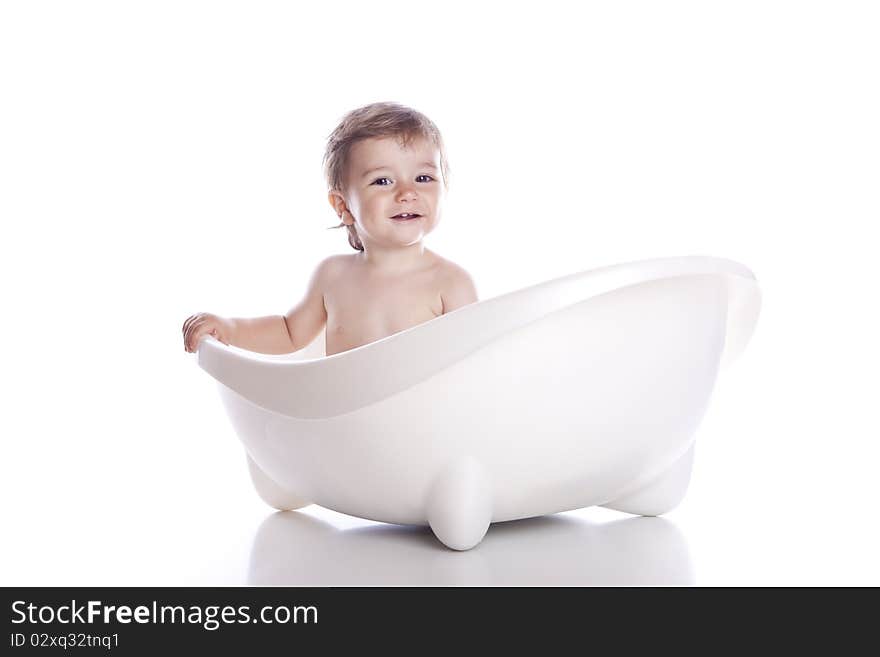 Boy in white bath tub