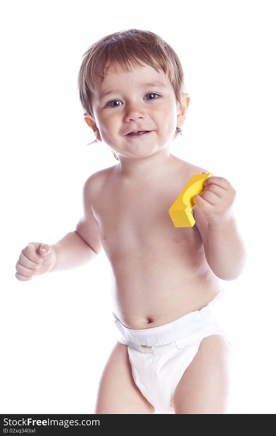 The kid plays with cubes on a white background