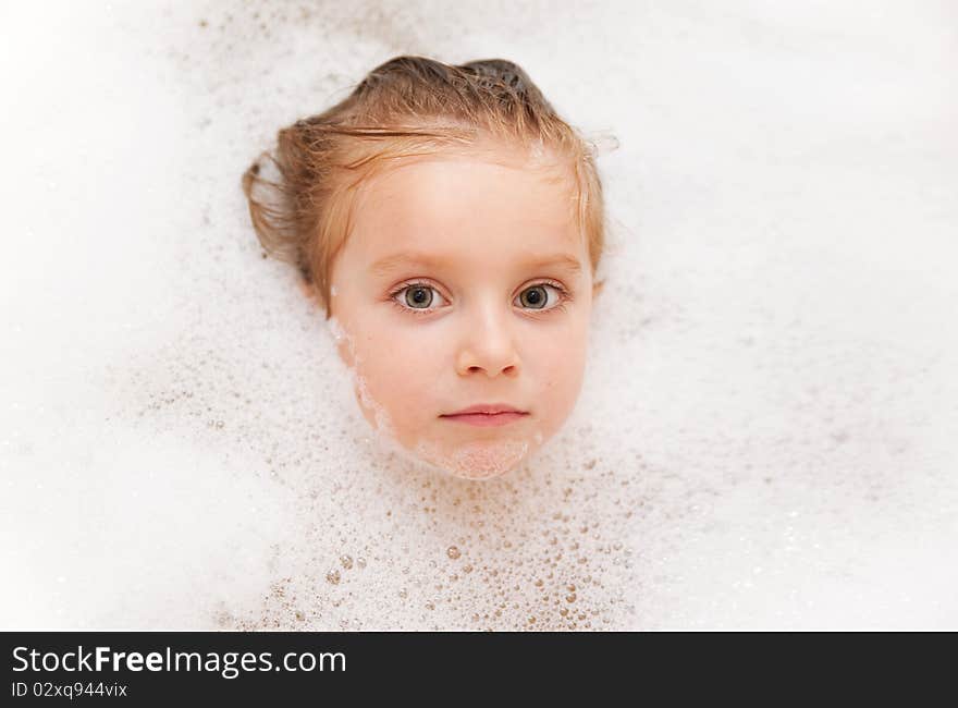 Photo of 3 years old girl having bubble bath. Photo of 3 years old girl having bubble bath