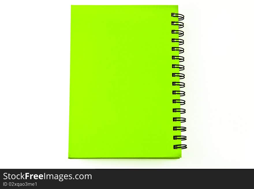 Green notebook on white.