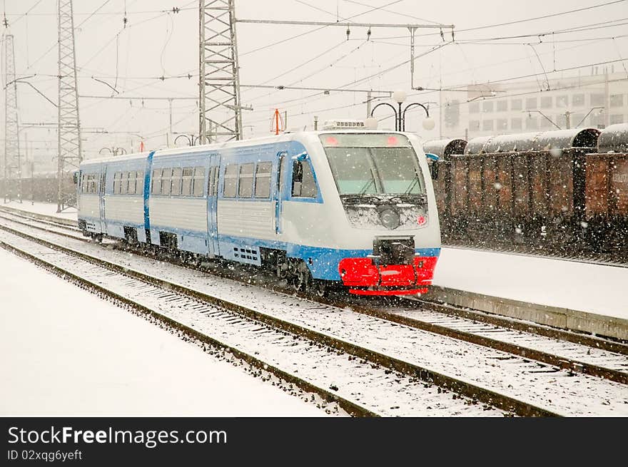 Railcar stands on a snowy winter station. Blizzard. Railcar stands on a snowy winter station. Blizzard