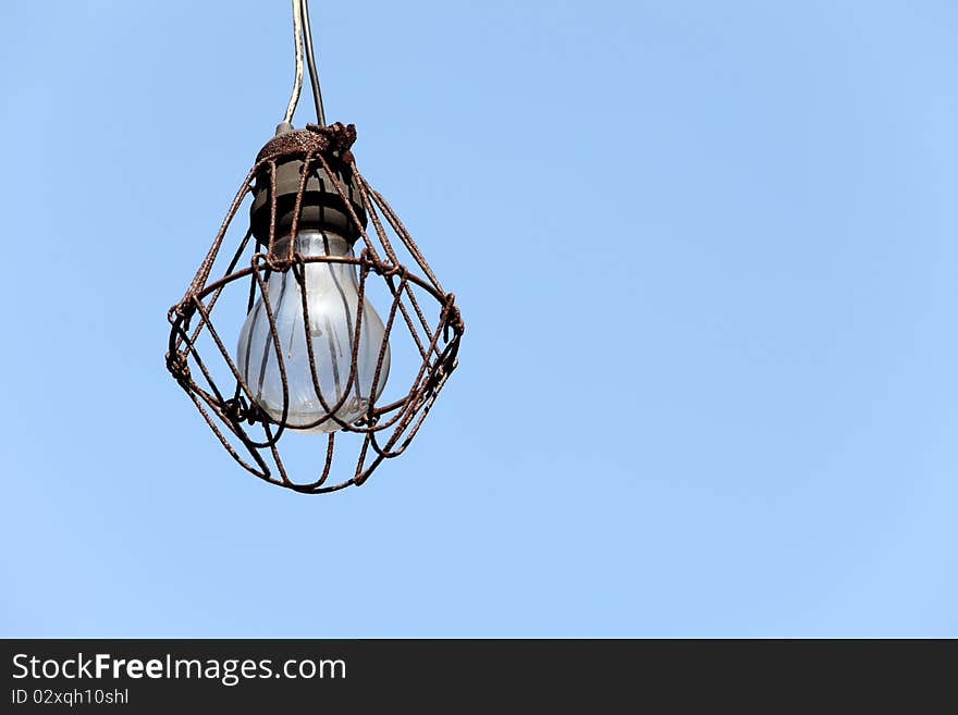 Old lamp in the blue sky