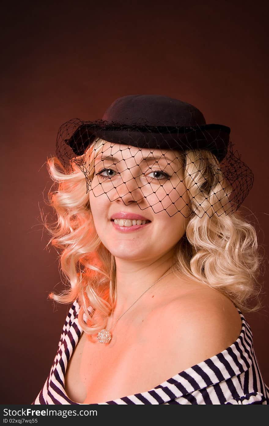 Beautiful Young Woman In A Hat With A Veil