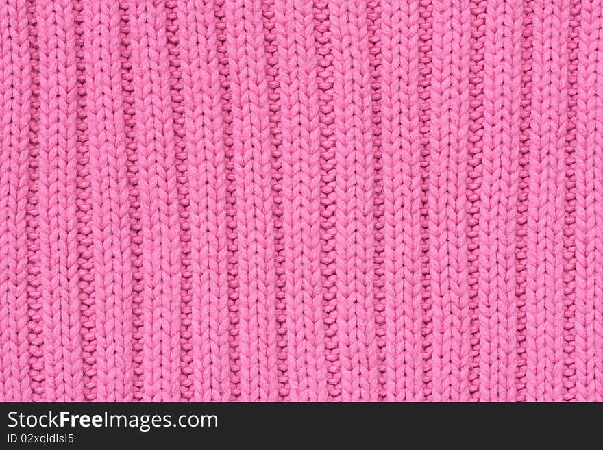 Background of knitted fabrics with warm pink things. Background of knitted fabrics with warm pink things