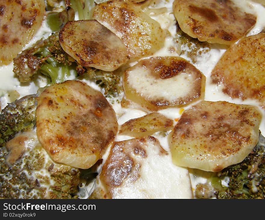 Potatoes and broccoli baked