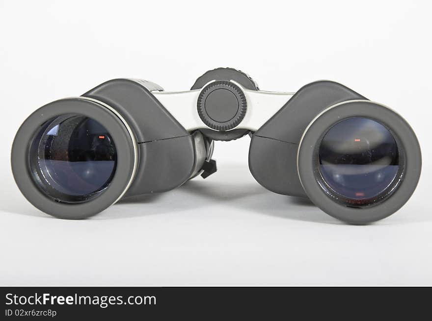 A pair of black rubber binoculars metaphor vision and ability to advance