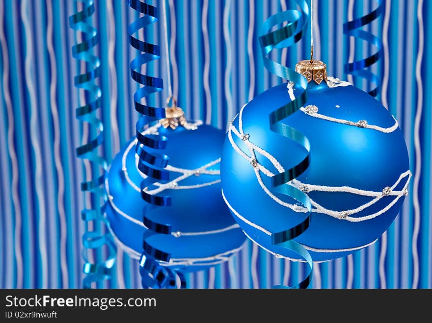 Christmas decoration from two blue balls on blue background. Christmas decoration from two blue balls on blue background