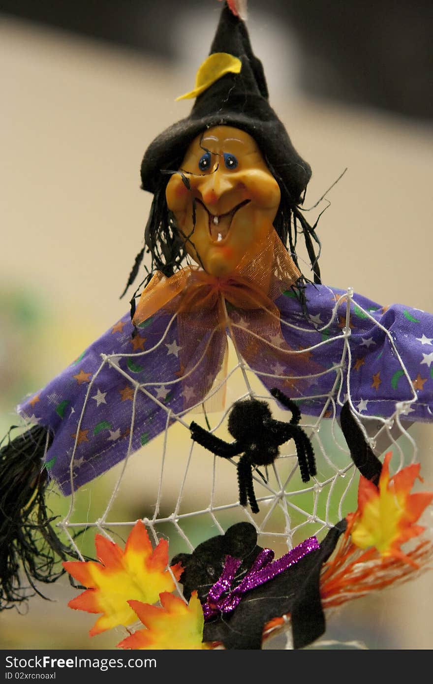 A miniature witch hung up for Halloween. A miniature witch hung up for Halloween