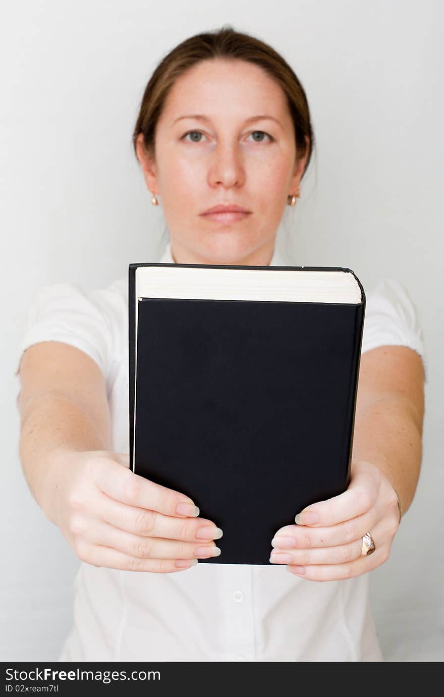 Beautiful woman hold a black big book. Beautiful woman hold a black big book