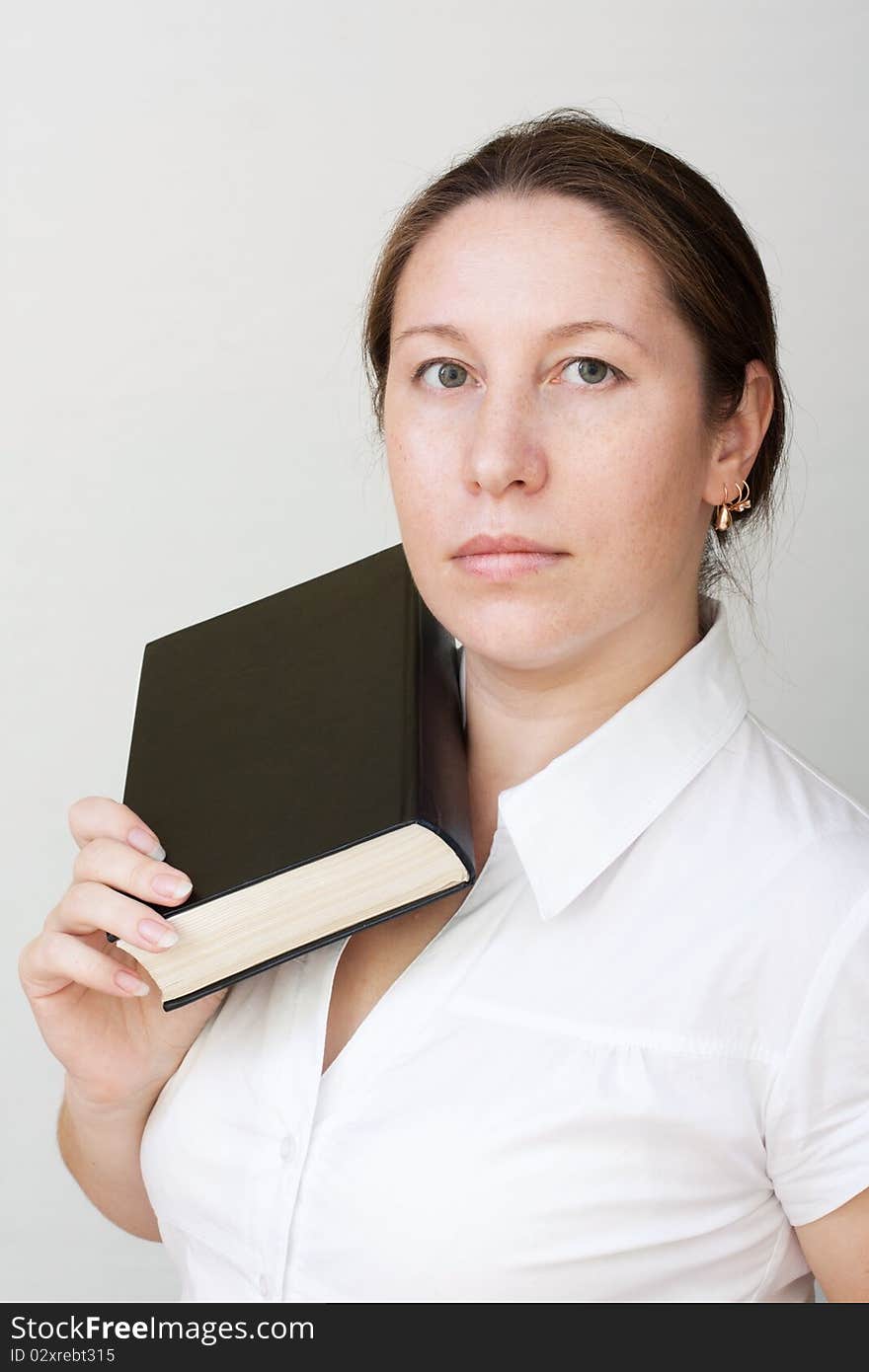 Beautiful woman hold a black big book. Beautiful woman hold a black big book