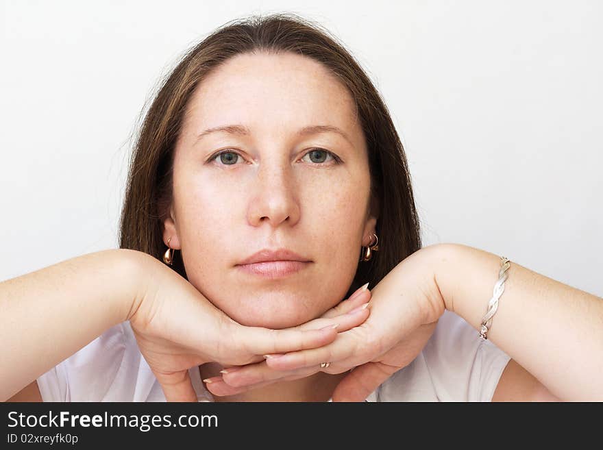 Portrait of the beautiful woman on gray background