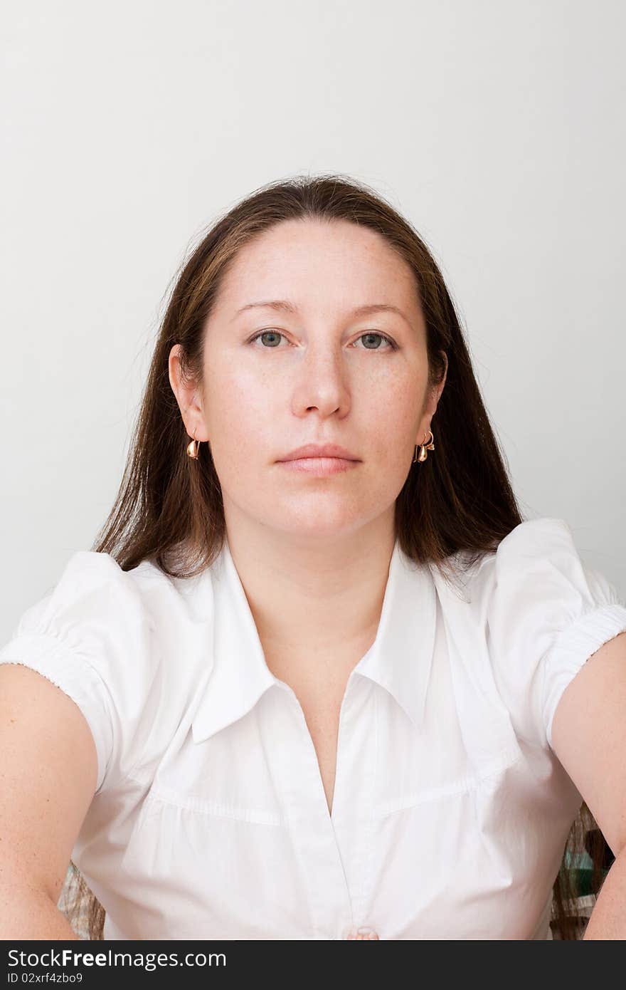 Portrait of the beautiful woman on gray background