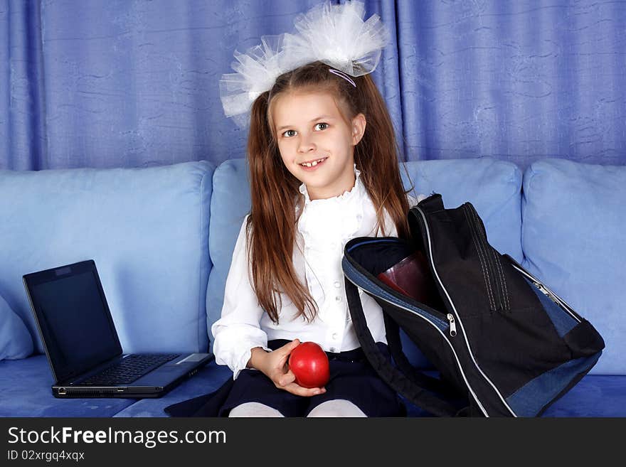 Schoolgirl With Laptop, Backpack And Red Apple