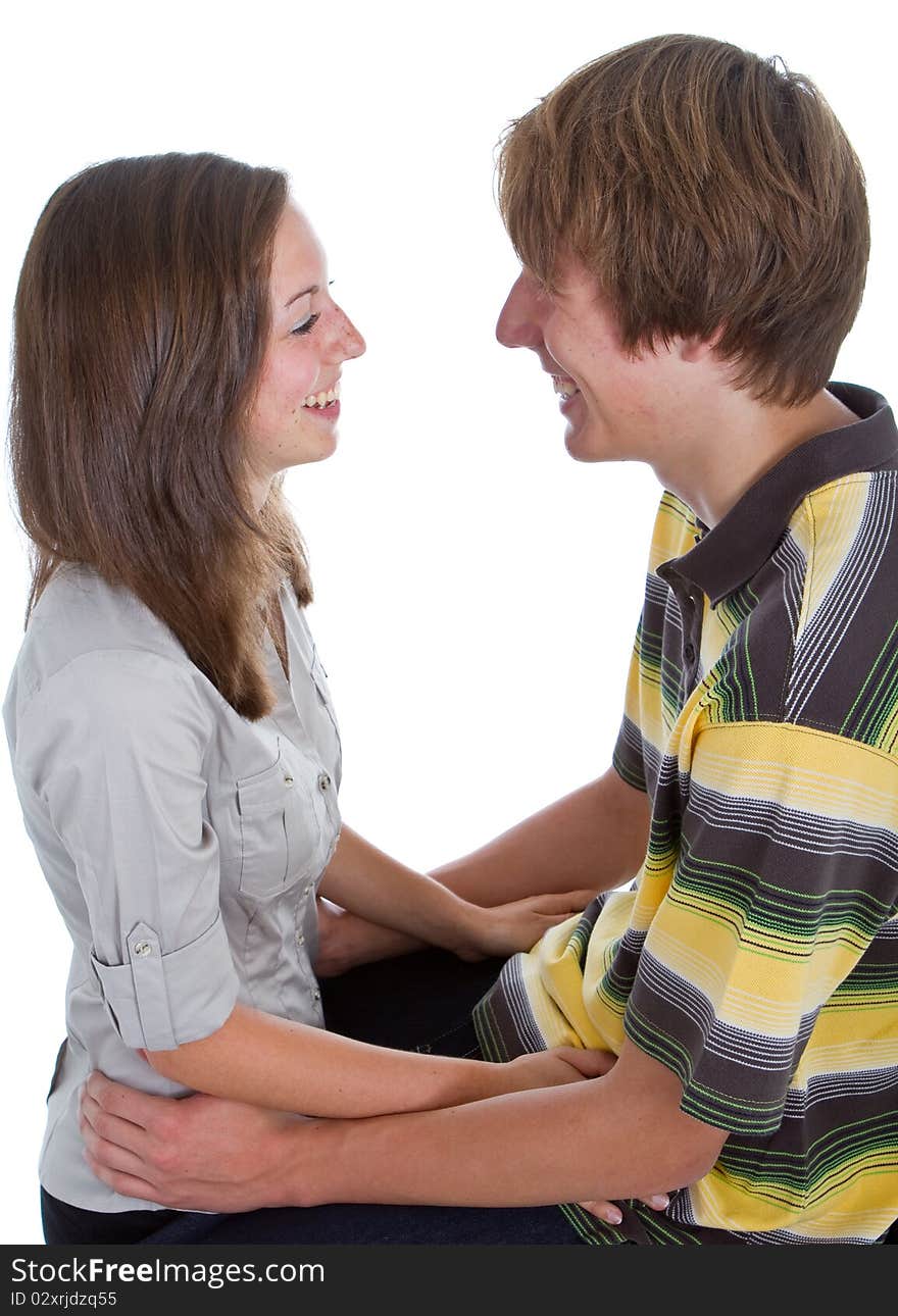 Two teenagers in love. Studio portrait isolated over white background.