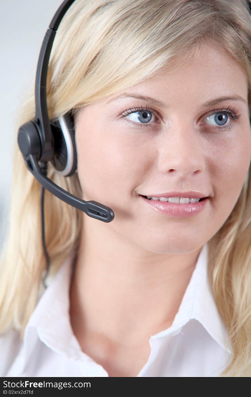 Closeup of blond woman with headphones and microphone. Closeup of blond woman with headphones and microphone