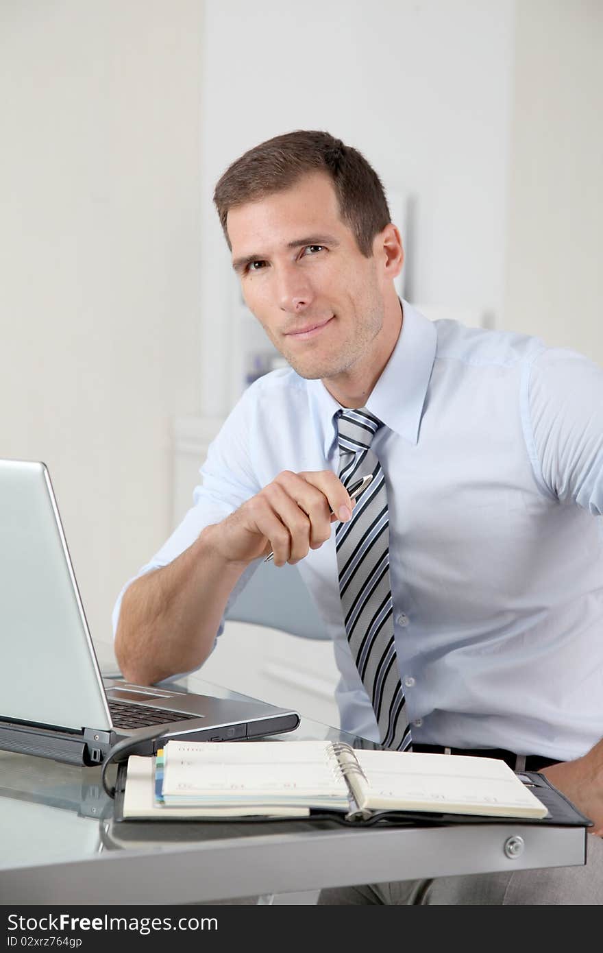 Man working in the office with laptop computer. Man working in the office with laptop computer