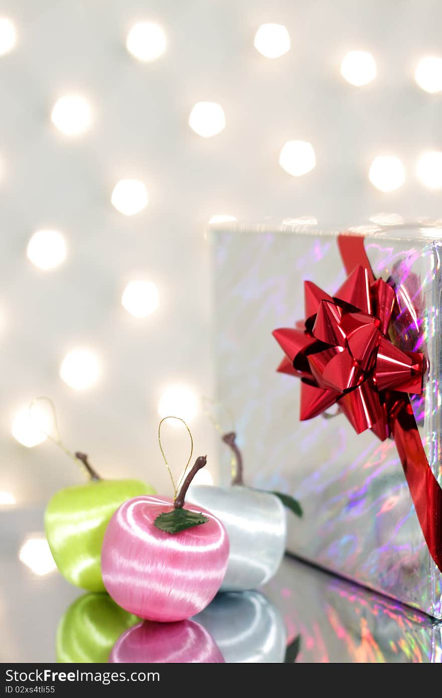 Three red Christmas ball and gift box. Three red Christmas ball and gift box