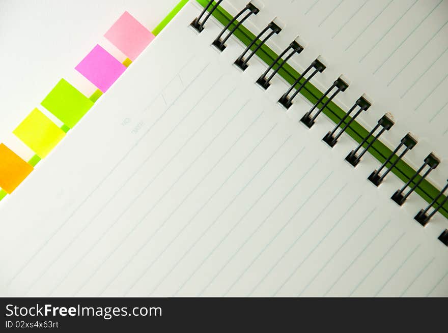 Isolated green notebook on white.