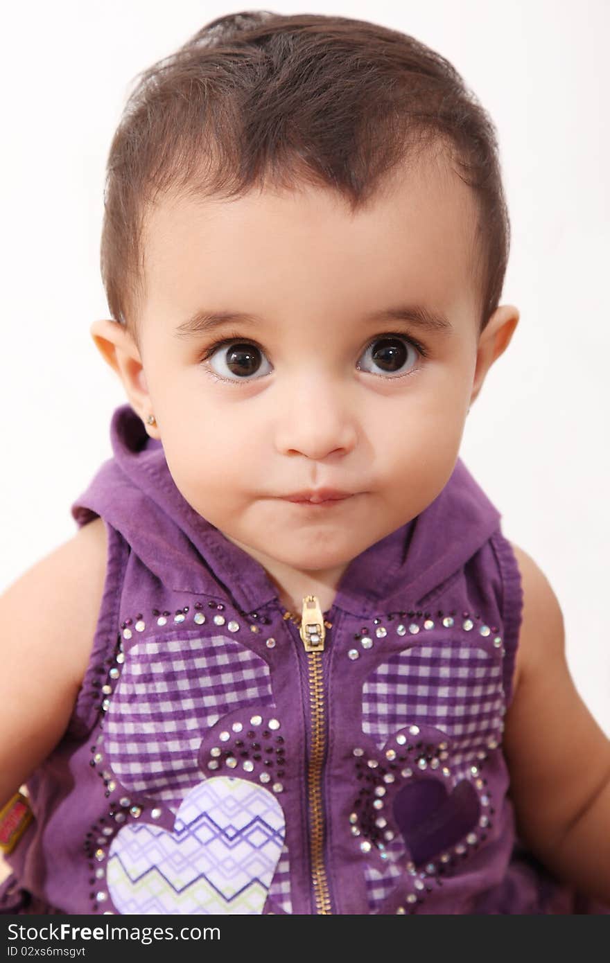 Funny girl looking at the camera over white background. Funny girl looking at the camera over white background