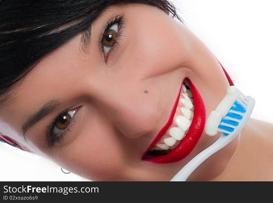 Smiling young girl with tooth-brush (isolated on white)