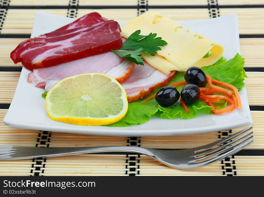 Food on a plate with meat and spices. Food on a plate with meat and spices