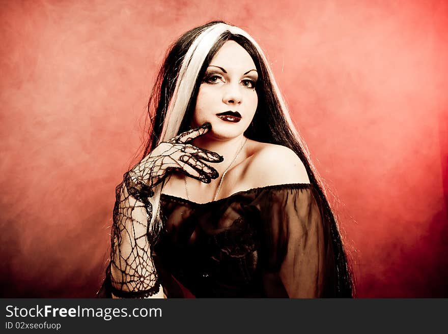 Gothic girl on smoke background