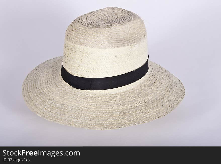 This image shows a simple hat with a black ribbon with white background