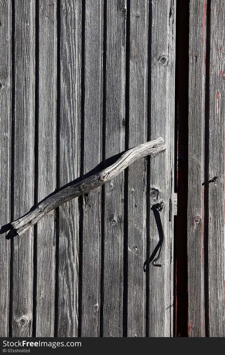 Handles and hasp on an old wooden door. Handles and hasp on an old wooden door