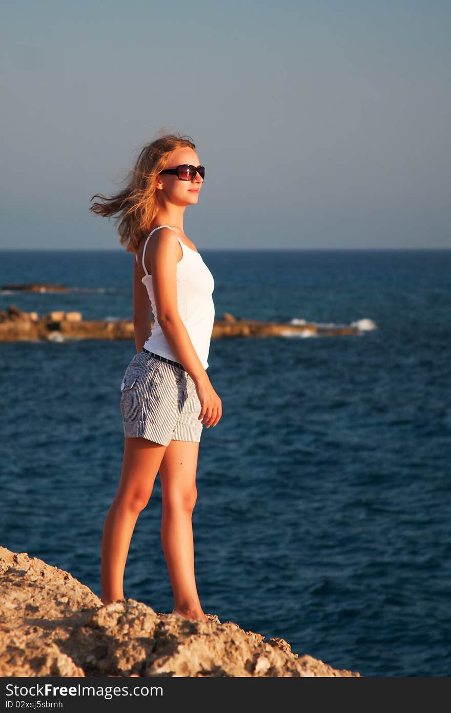 Woman standing on a rock