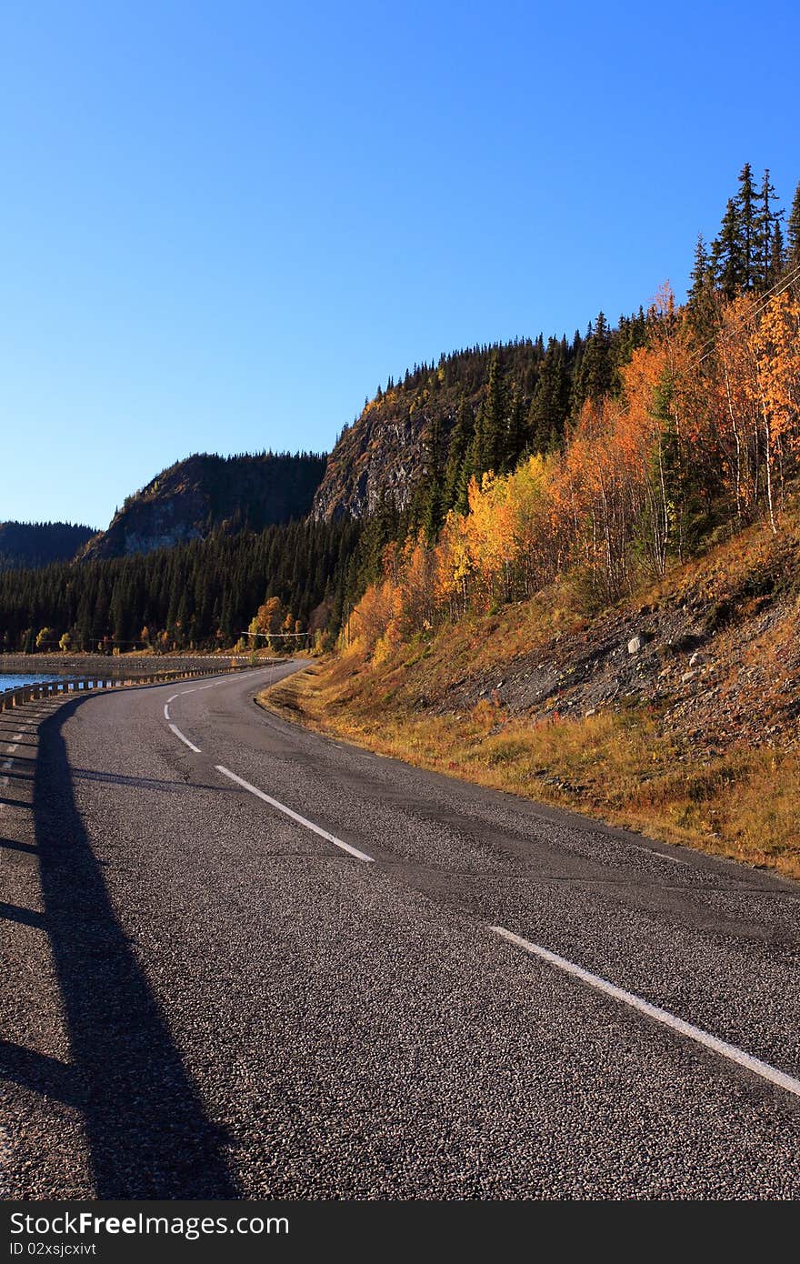 Long and winding road in the swedish mountain landscape. Long and winding road in the swedish mountain landscape