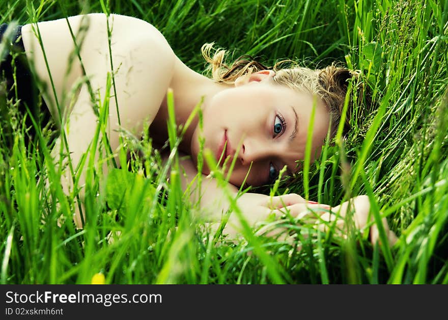 Beautiful young woman in meadow