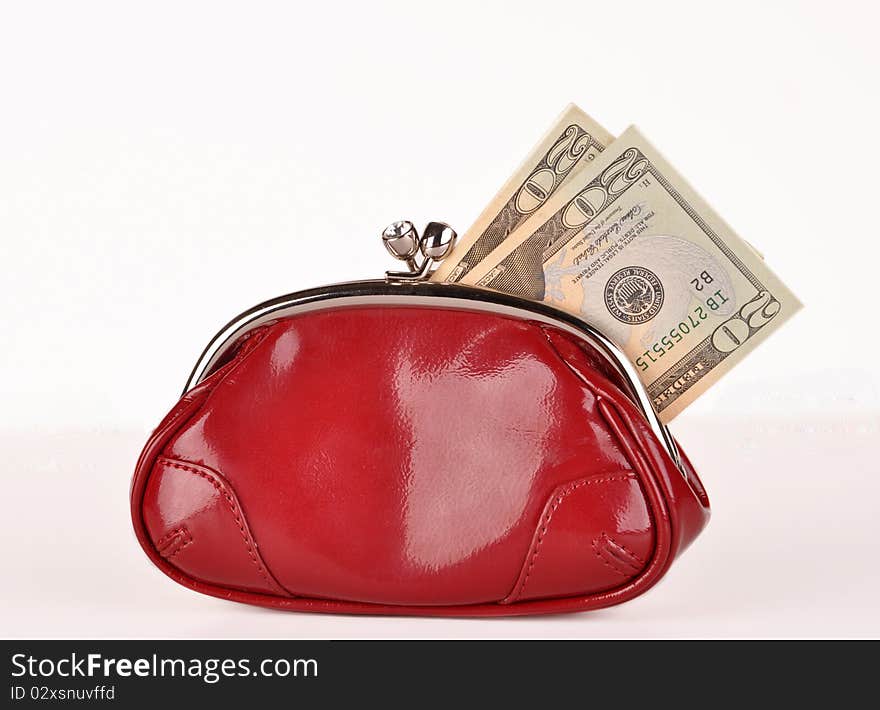 Red clutch purse with  twenty dollar bills. Red clutch purse with  twenty dollar bills