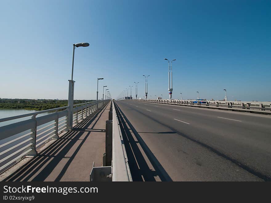 Bridge over water with laterns on the sky background. Bridge over water with laterns on the sky background