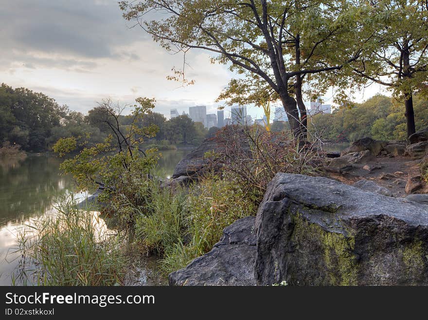 Early autumn in Central Park by the lake. Early autumn in Central Park by the lake