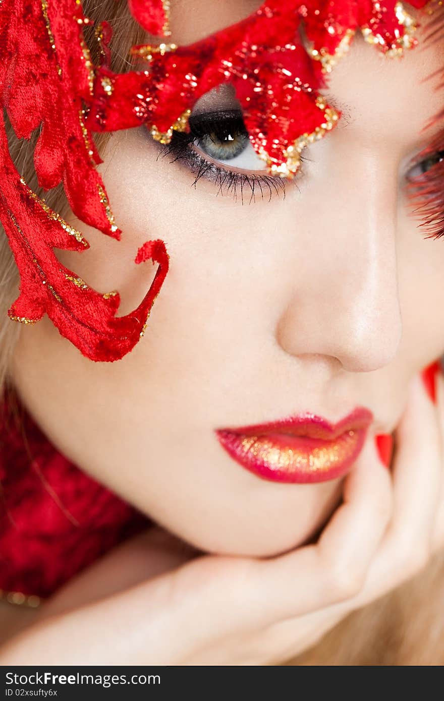 Beautiful fashionable woman with art leaves on head