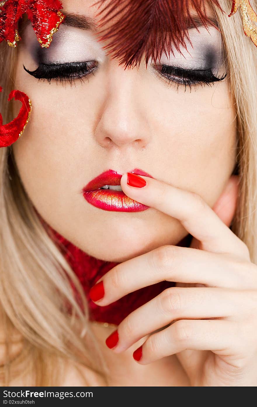 Beautiful fashionable woman with art leaves on head