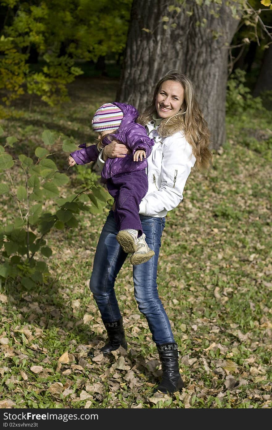 Mom and daughter having fun in  park