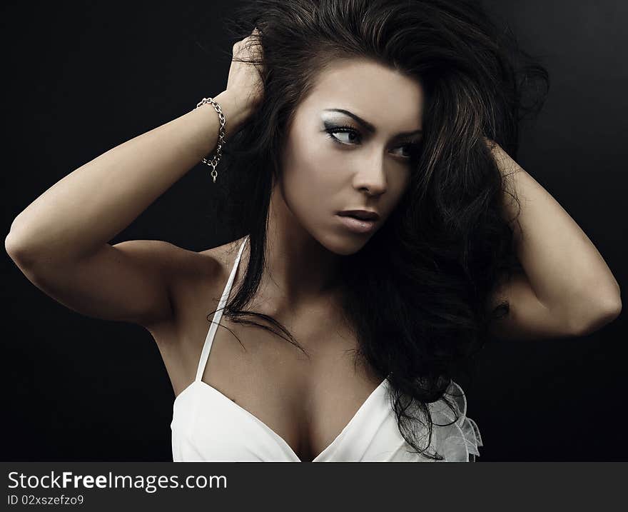 Black hair young woman portrait, studio shot. Black hair young woman portrait, studio shot