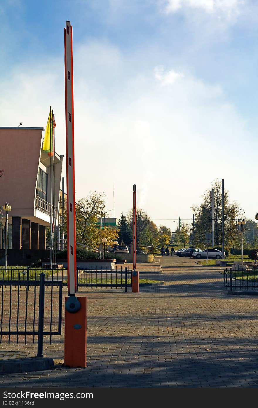 Two barriers, blocking road on small parking