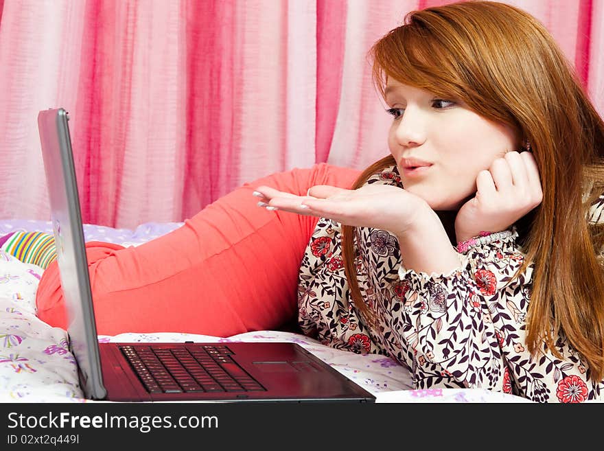 Portrait of beautiful red-haired girl with laptop. Portrait of beautiful red-haired girl with laptop