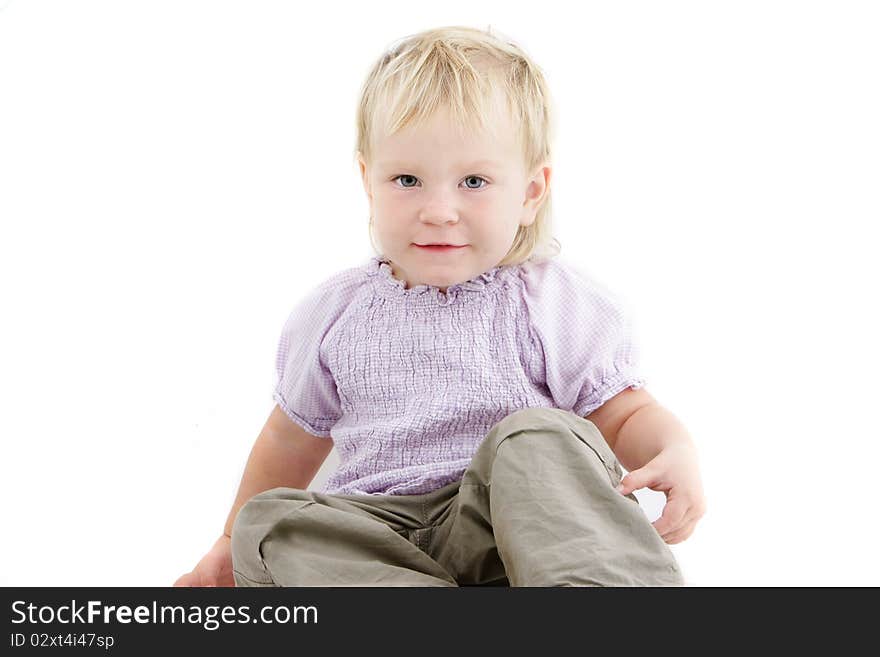 Studio portrait of cute toddler girl over white