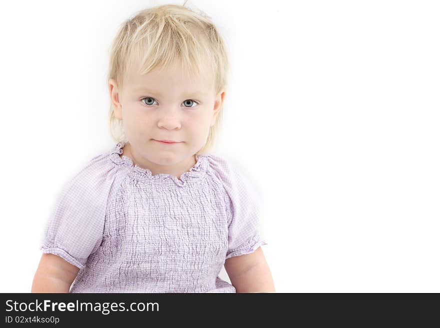 Studio portrait of cute toddler girl over white