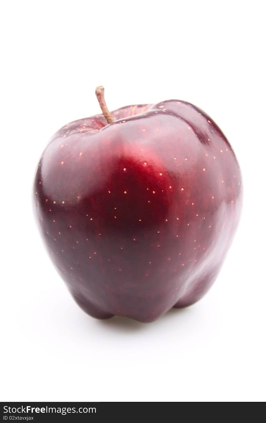 Red shining an apple on a white background. Red shining an apple on a white background