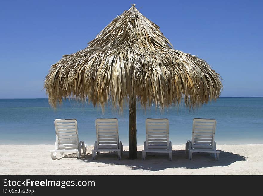 Four Chairs And Palapa