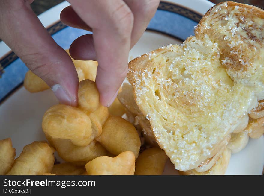 Deep-fried dough stick and bread