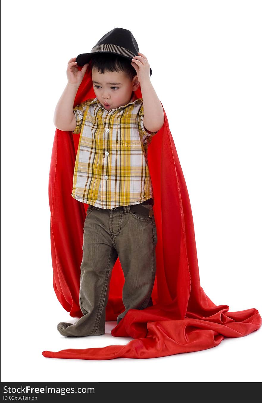 Sweet boy with hat and red silk fabric, isolated on white. Sweet boy with hat and red silk fabric, isolated on white