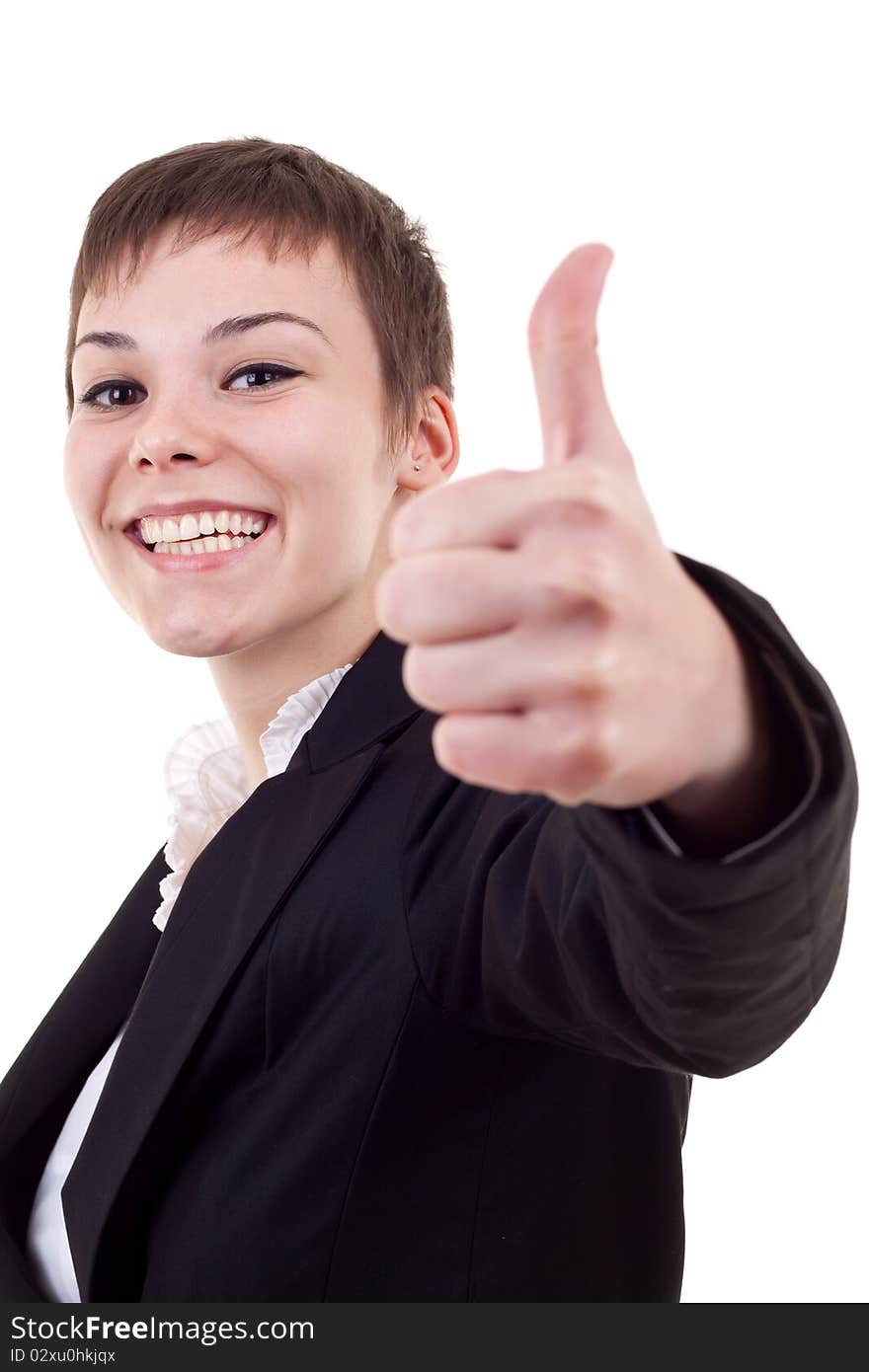 Thumbs Up! Studio partrait of young business woman showing OK sign, looking at camera and smiling. Isolated on white background