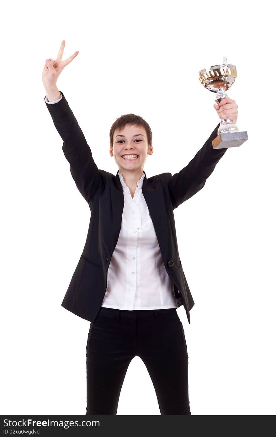 Portrait of an excited young business woman winning a trophy against white background