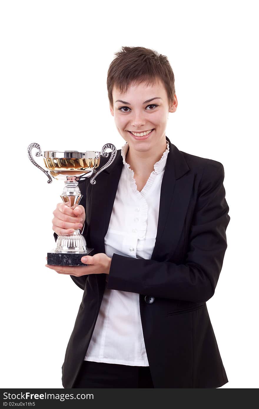 Portrait of a confident young business woman holding a silver cup against white background